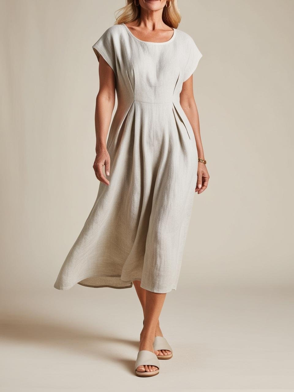 age 40 plus A linen cotton midi dress offers coverage airflow and polish. Pair with slides for elongating legs